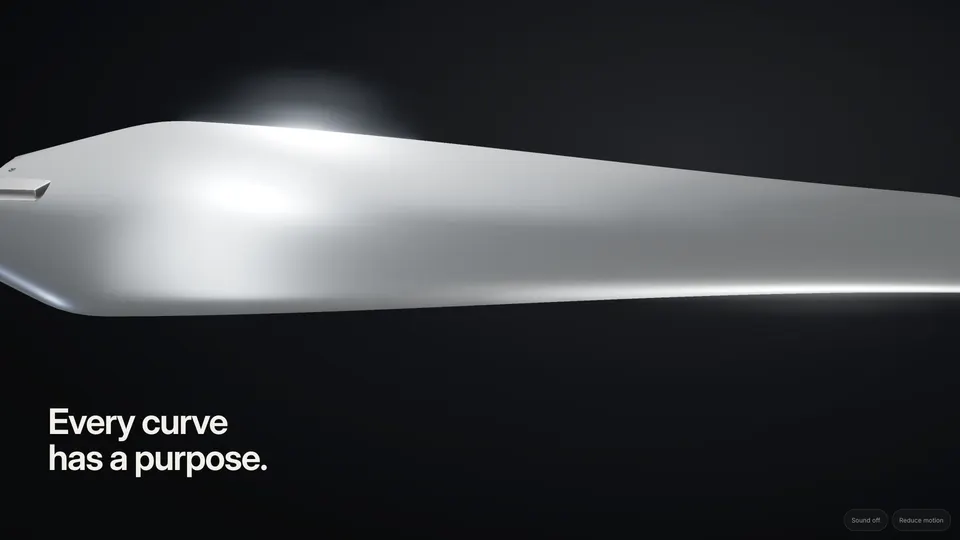 Extreme close-up along the edge of a single brushed-metal blade